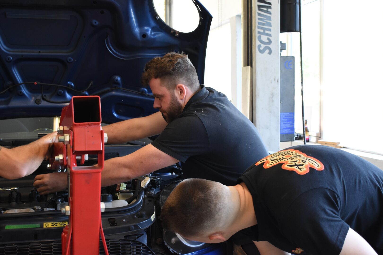 preventive inspection of a car engine with tools and diagnostics